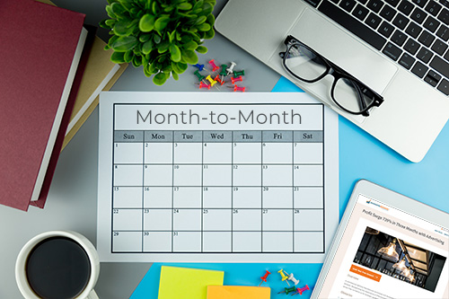 Calendar showing month to month for PPC advertising services and tablet showing case study from Awesome Dynamic, Ecommerce Advertising Consultants