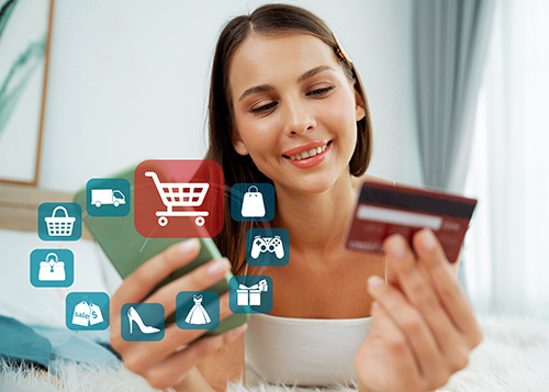 women holding credit card shopping on phone
